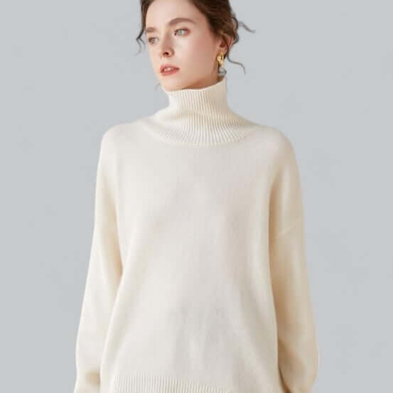 Cozy women's knitted roll neck jumper in a soft winter fabric, perfect for elegant cold-weather style.