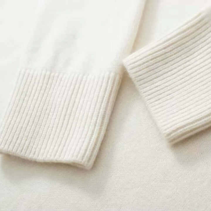 Elegant women's knitted roll neck winter top. Cozy long sleeve jumper for stylish cold days.