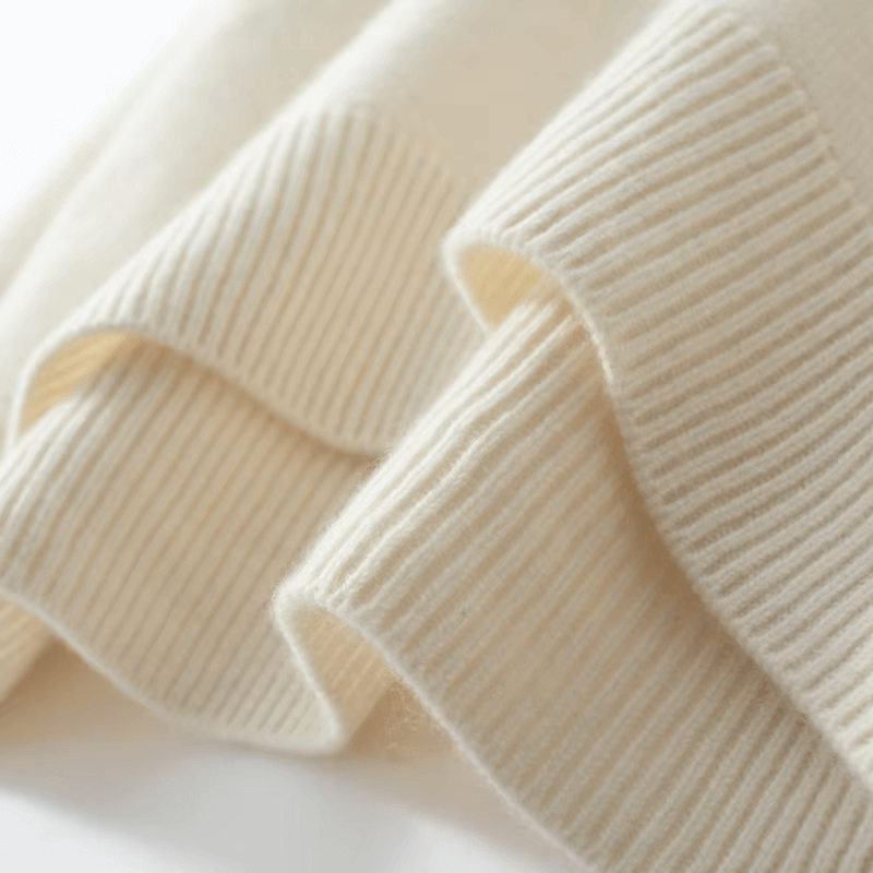 Warm women's knitted roll neck sweater. Cozy long sleeve pullover, an elegant choice for winter.