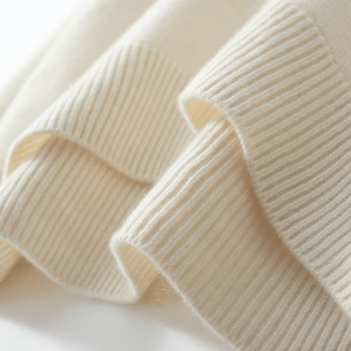 Warm women's knitted roll neck sweater. Cozy long sleeve pullover, an elegant choice for winter.