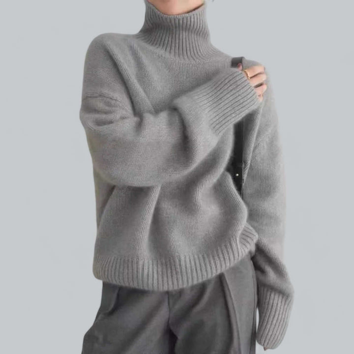 Stylish women's roll neck jumper. Chic knitted long sleeve top, cozy and elegant for winter fashion.