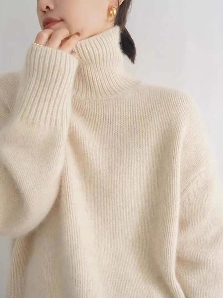 Cozy women's loose knit high neck sweater in acrylic blend, perfect for fall & winter comfort and style.