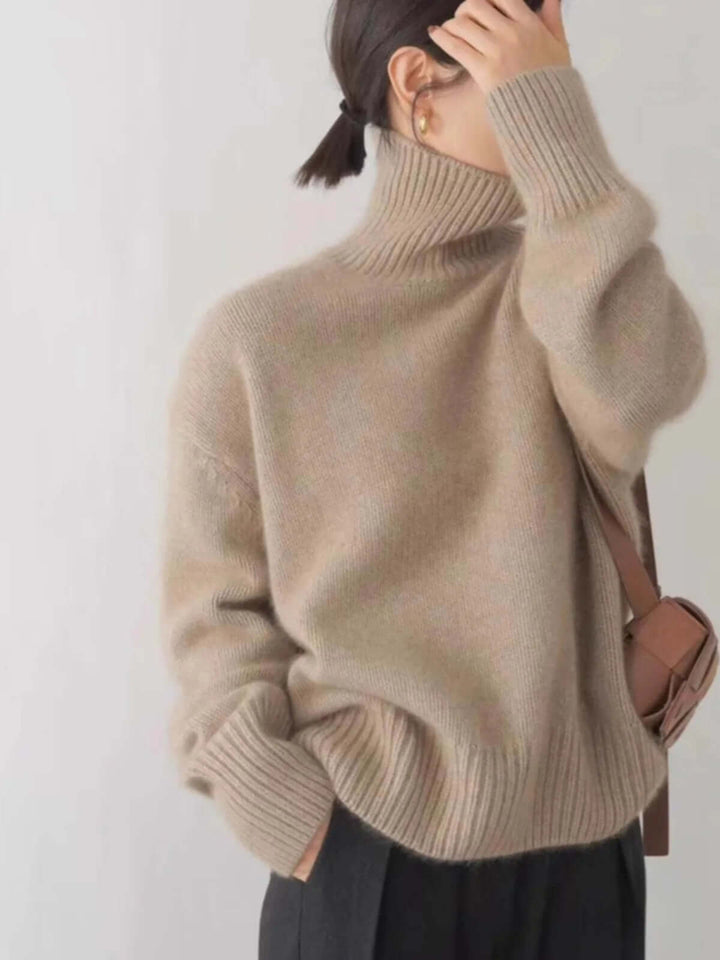 Versatile women's high neck loose knit sweater for cozy fall & winter layering. Stylish and comfortable.