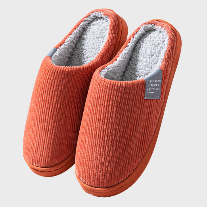 Warm women's indoor slippers, featuring soft comfort and easy slip-on design for winter.