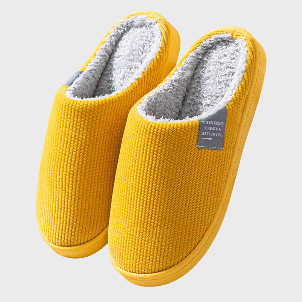 Slip-on women's home slippers, designed for soft comfort and warmth during cold winter months indoors.