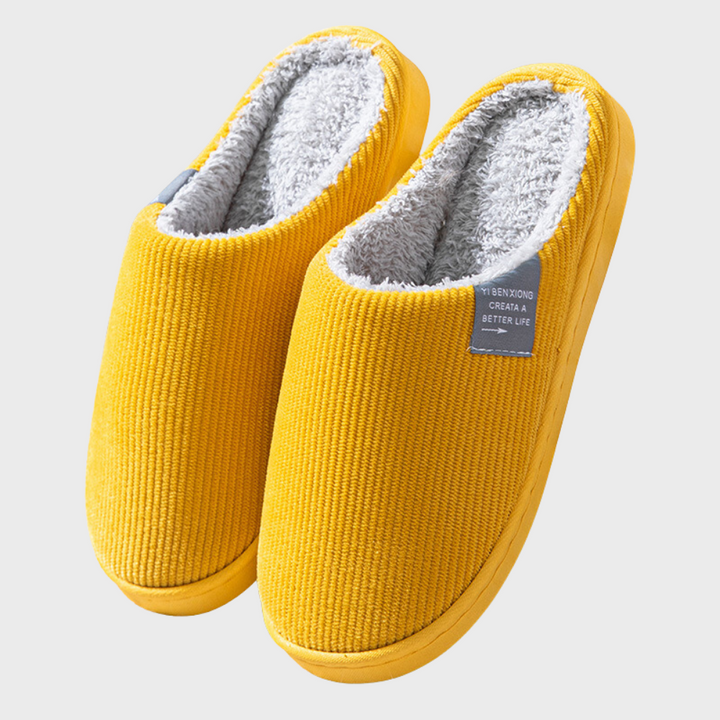 Slip-on women's home slippers, designed for soft comfort and warmth during cold winter months indoors.