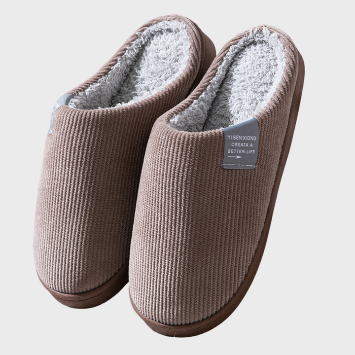 Warm women's indoor footwear, cozy winter slippers offering soft comfort and a snug fit.