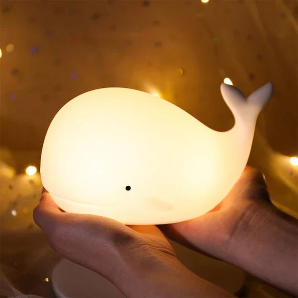 Touch-control whale night light for kids, provides a comforting, color-changing glow for bedtime.