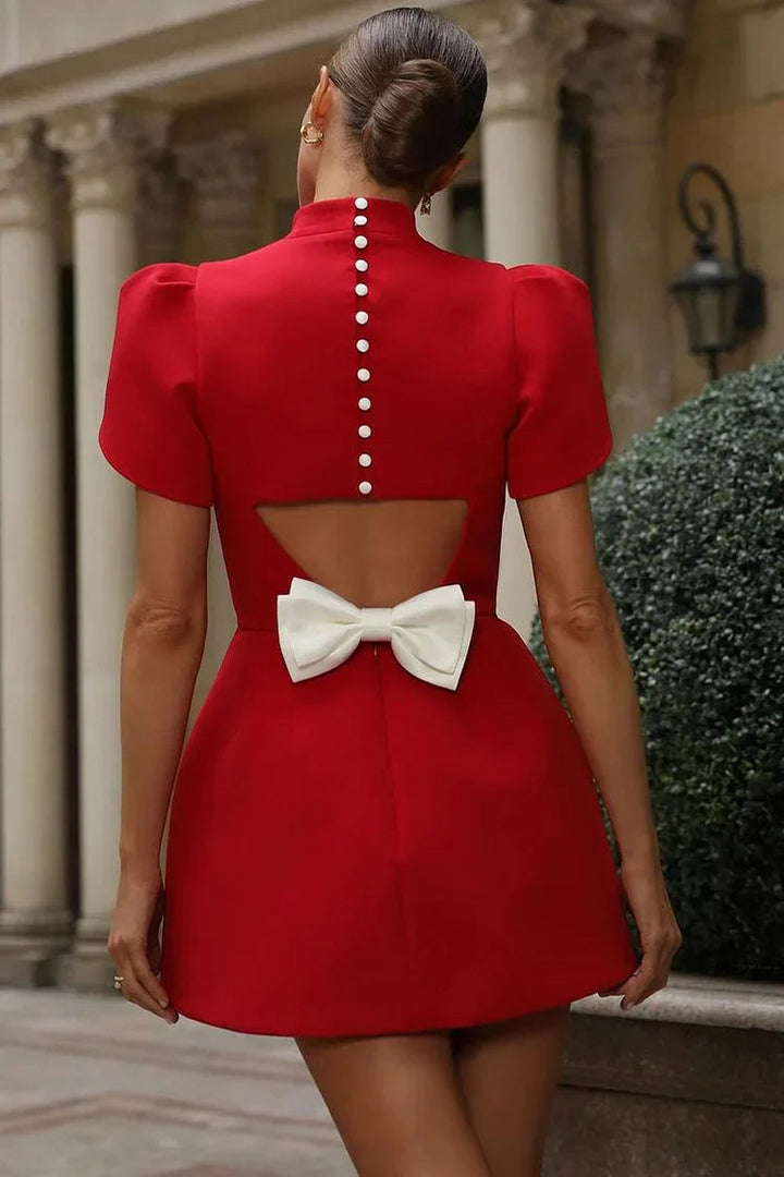 Cute women's mini cocktail dress with puff sleeves, a stylish choice for any party.