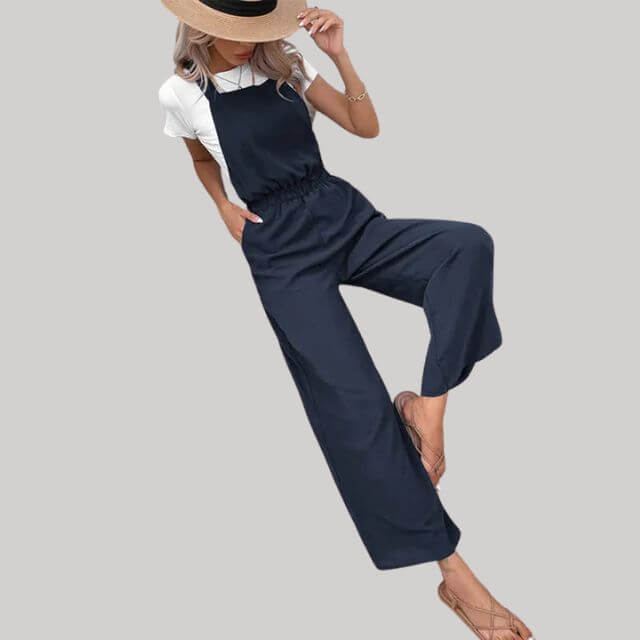 Stylish dark blue wide-leg women's jumpsuit, a comfortable and elegant one-piece perfect for spring and summer fashion.