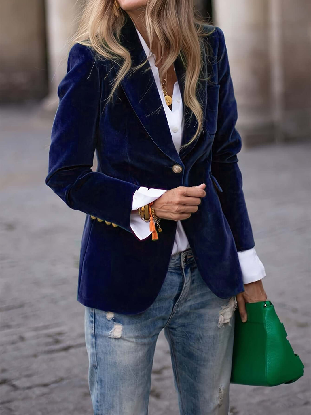 Elegant dark green velvet blazer for women, featuring striking golden buttons, ideal for formal occasions.