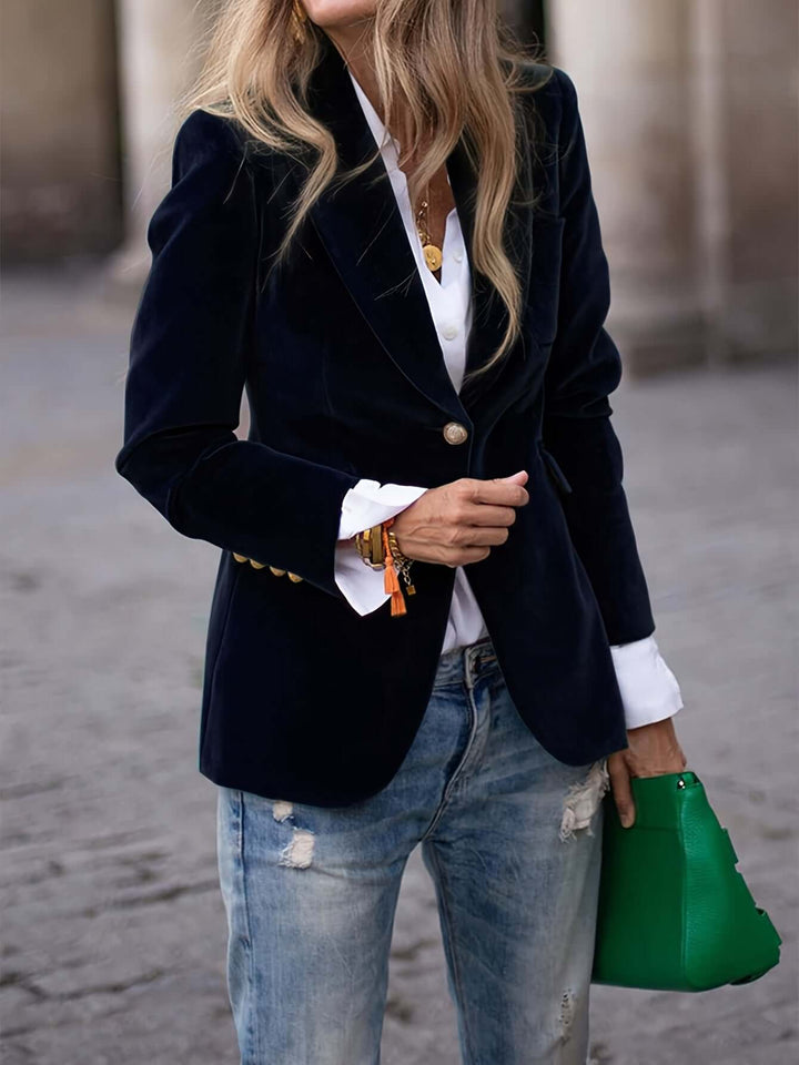 Women's professional dark green velvet jacket with golden buttons, a chic and elegant outerwear piece.