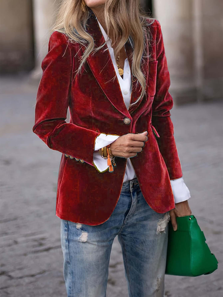 Sophisticated women's velvet blazer, dark green with elegant golden buttons for smart casual style.