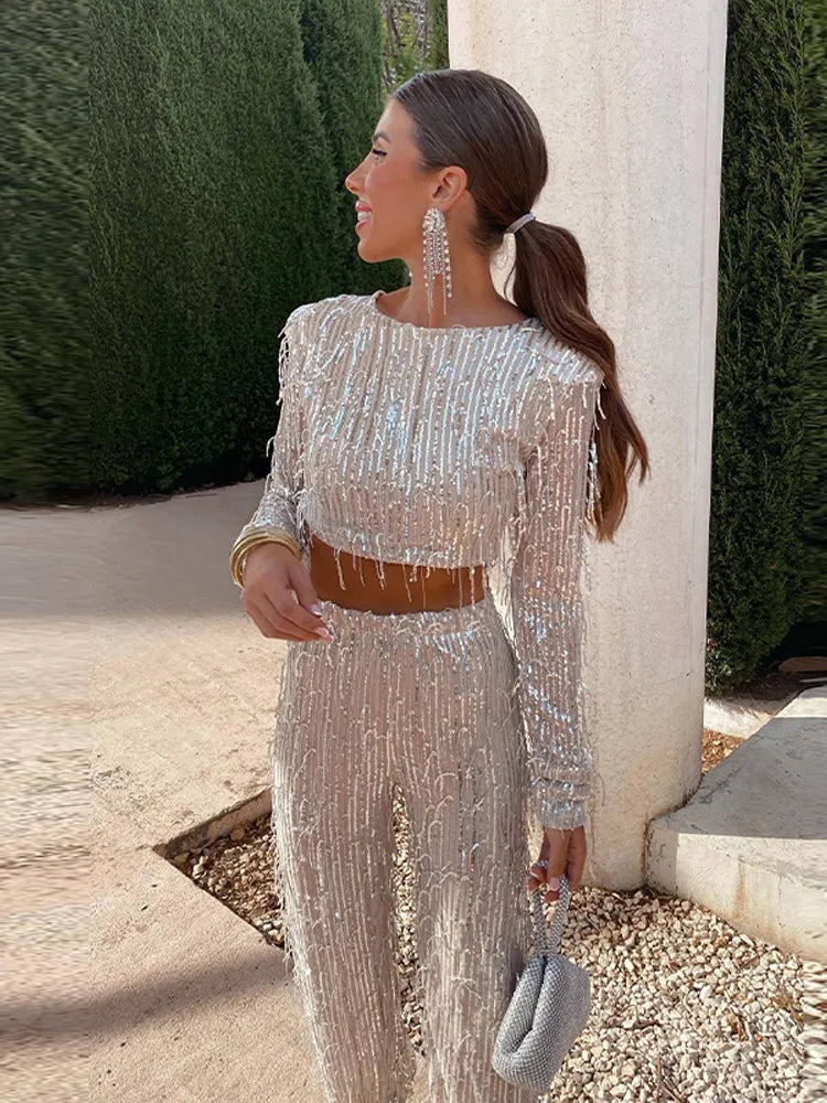 Dazzling women's sequin two-piece set, perfect for parties & special occasions. Glamorous crop top & high-waisted skirt.