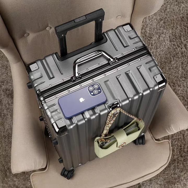 Sleek hard shell suitcase with aluminum frame, modern design for stylish & secure travel.