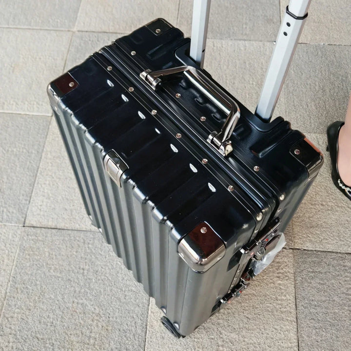 Robust hard shell suitcase, ideal for business trips & vacations, with aluminum frame.