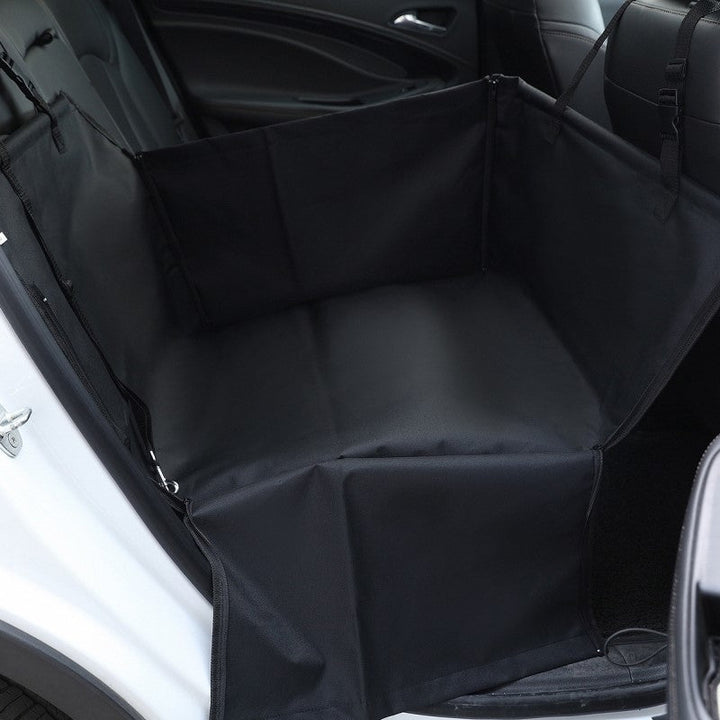 Happy dog resting comfortably on a waterproof back seat car cover, protecting vehicle from pet hair & muddy paws.