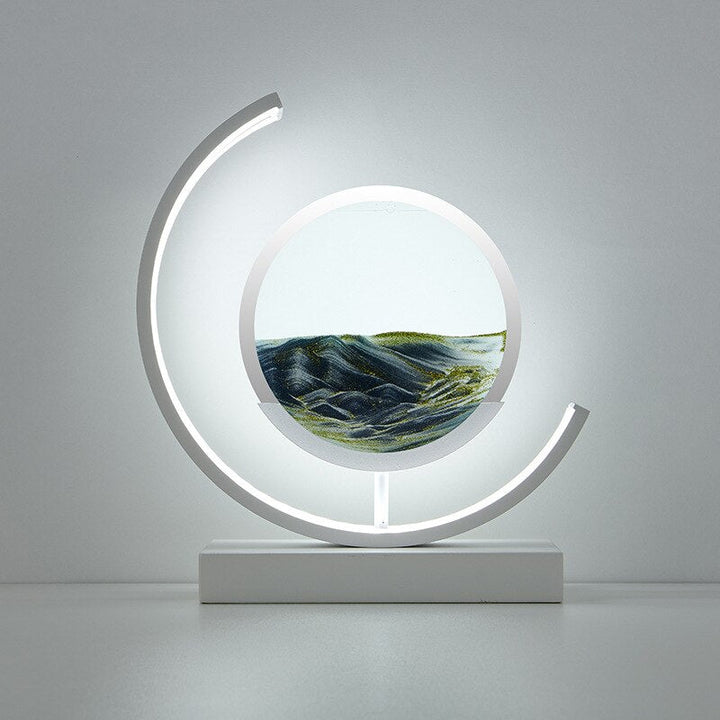 Dynamic Sand Art LED Table Lamp with flowing sandscapes and soft lighting, perfect for home or office decor transformation.