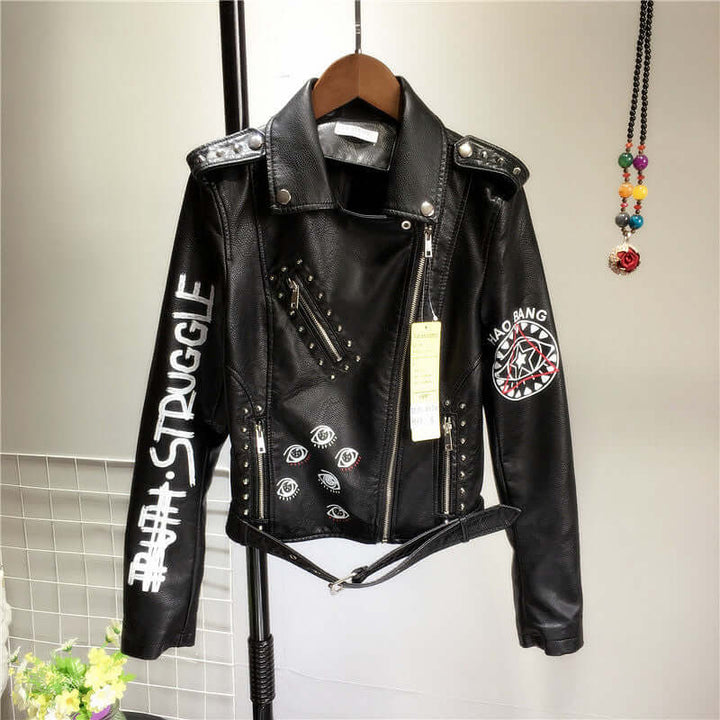 Women's black PU leather biker jacket, an edgy statement piece with rivet details for spring or fall fashion.