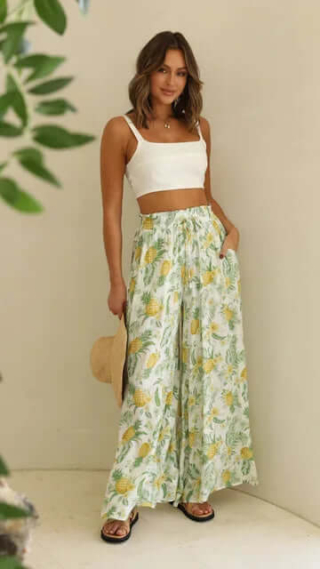 Flowy women's loose fit trousers with elastic drawstring waist, ideal for comfortable daily wear.