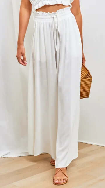Women's casual loose fit drawstring pants styled for effortless summer fashion.