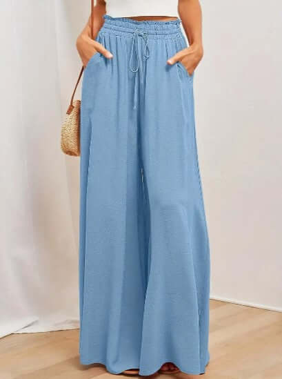 Relaxed fit women's drawstring pants in breathable fabric, ideal for everyday casual style.