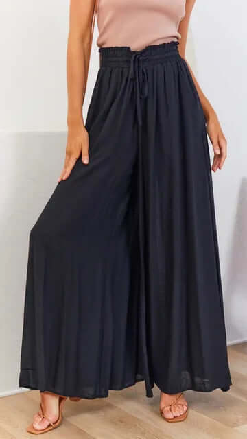 Stylish women's loose fit drawstring casual trousers, offering comfort and relaxed elegance.