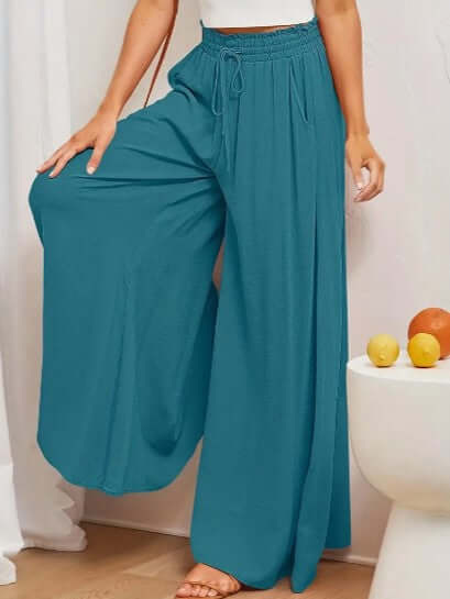 Side view of women's casual loose fit drawstring trousers, showcasing comfort and modern style.