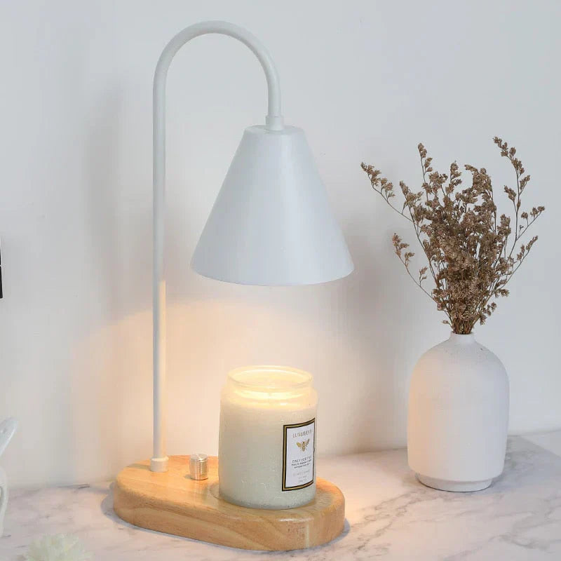 Modern electric candle warmer lamp, a sleek home decor item for cozy evenings & safe, flameless candles.