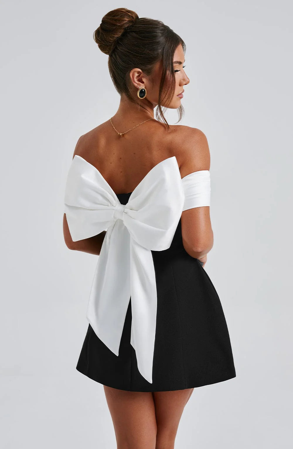 Versatile elegant black mini dress for women. Great for evening parties, cocktails & formal special occasions.