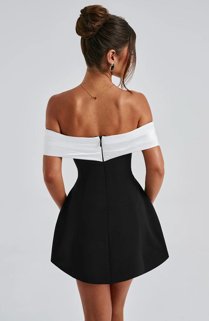 Sleek black structured mini dress for women. Elegant evening party and formal cocktail attire.