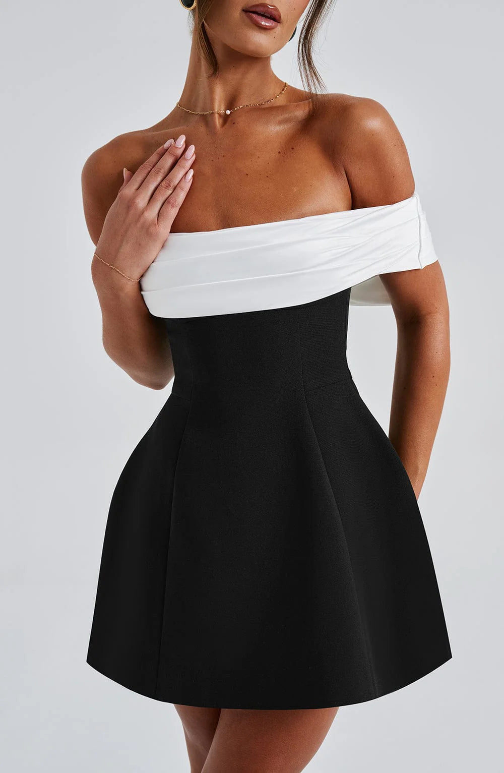 Sophisticated black mini dress for women. Elegant party, evening, and formal special occasion wear.