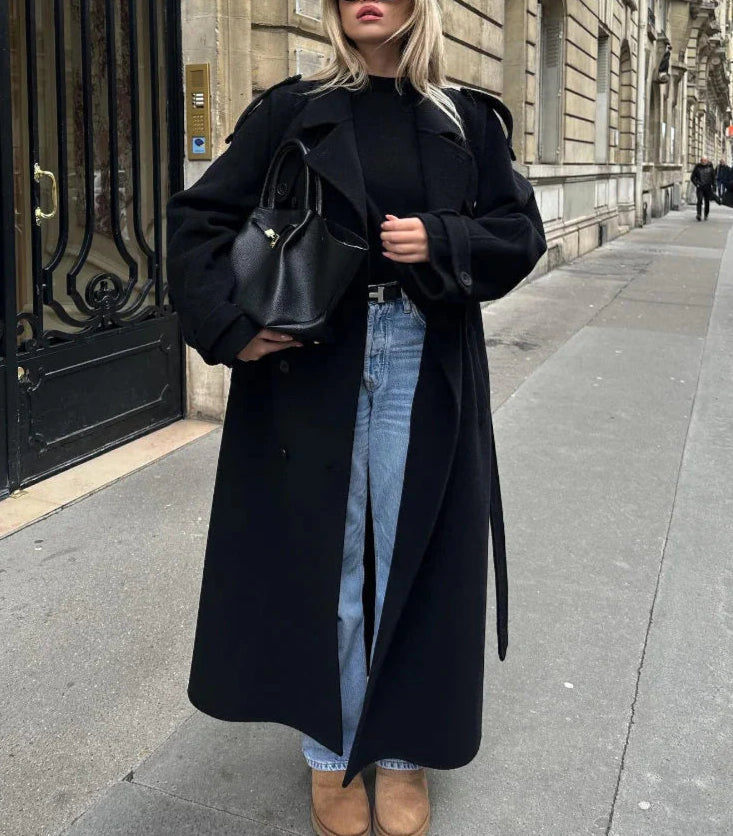 Modern elegant women's black long coat, double-breasted design for a chic, sophisticated & classic wardrobe.