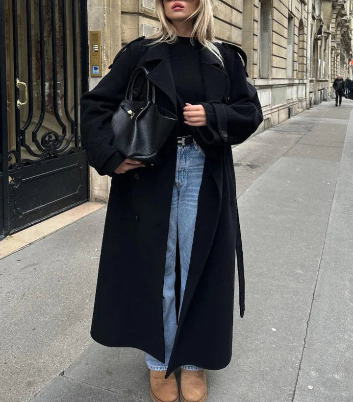 Modern elegant women's black long coat, double-breasted design for a chic, sophisticated & classic wardrobe.