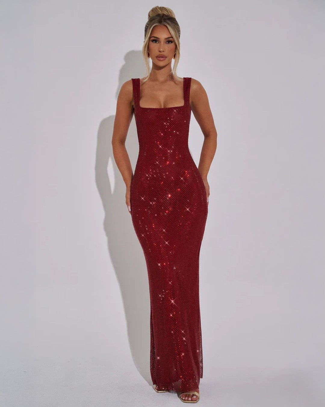 Elegant black embellished formal evening gown for women, perfect for special occasions & parties. Glamorous maxi dress.