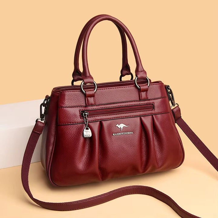 Black faux leather women's shoulder bag with elegant design, practical for everyday style.