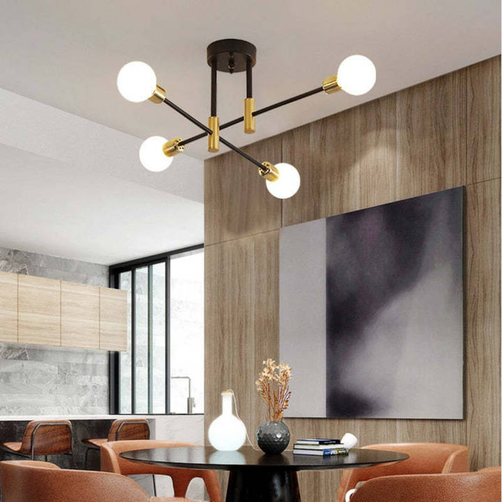 Overhead view of black & gold modern LED ceiling lamp. Stylish and elegant lighting for any room.