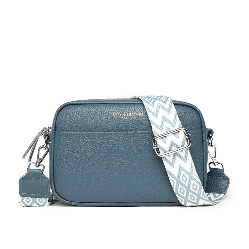 Fashionable green pebbled leather crossbody bag, a versatile women's accessory with designer quality.