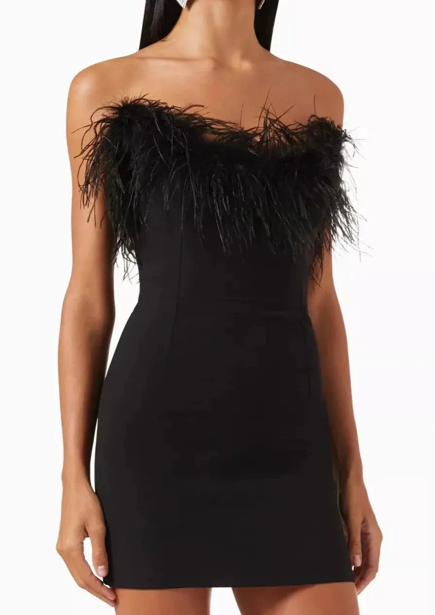 Sleek black off-shoulder minidress for women. An elegant choice for parties, evening events, and date nights.