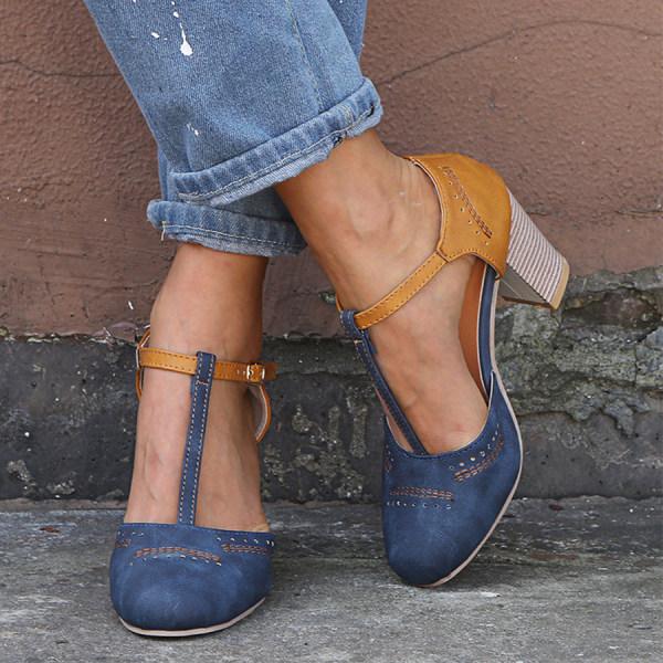 Retro-inspired women's T-strap block heels in a rich brown, offering comfort and timeless style.