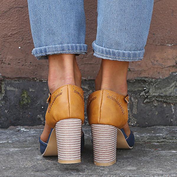 Pair of black women's T-strap block heels, showcasing their retro design and suitability as comfortable party shoes.
