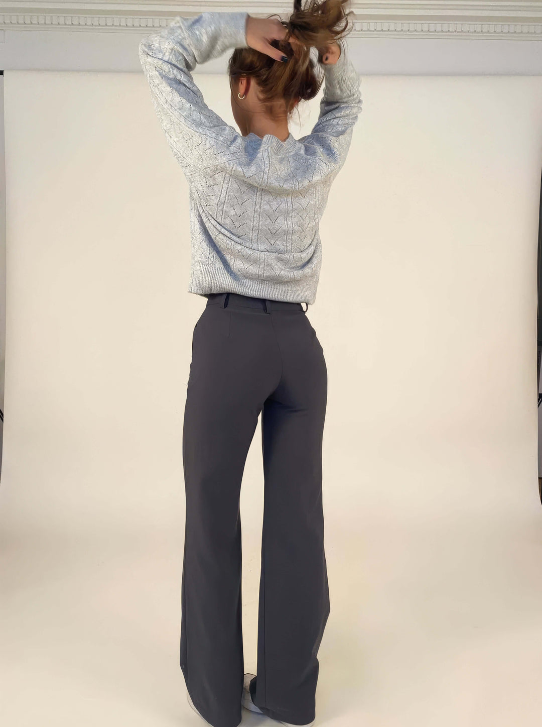 Women's blue wide leg trousers, featuring a comfortable waist and a modern, relaxed silhouette.
