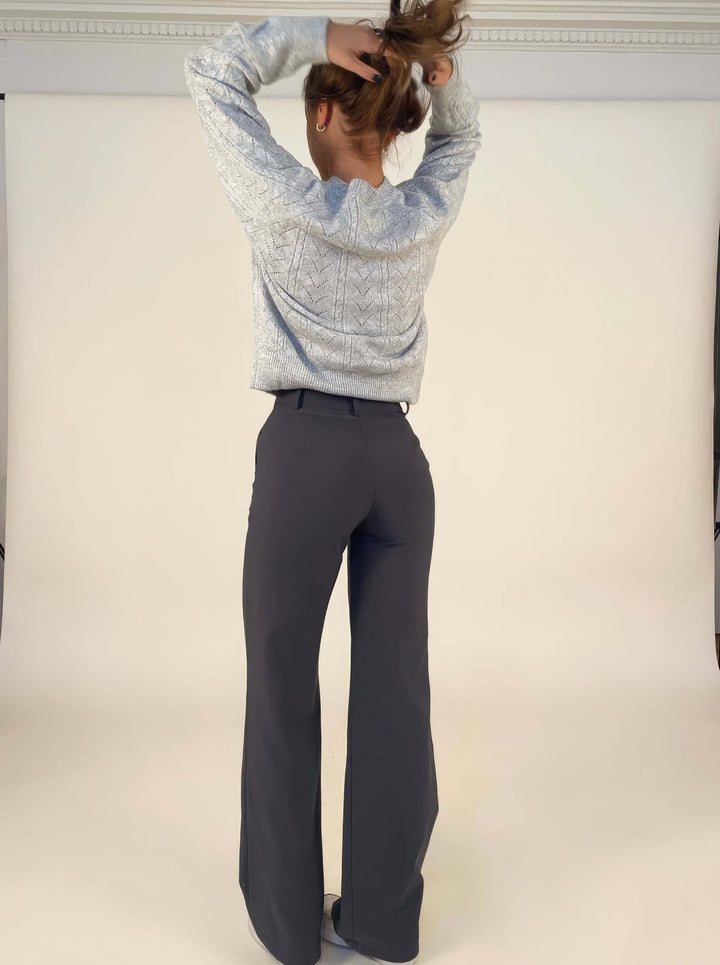 Women's blue wide leg trousers, featuring a comfortable waist and a modern, relaxed silhouette.