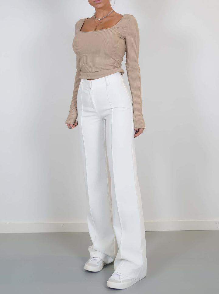 Stylish white wide leg trousers made from soft polyester, offering a chic and versatile option.