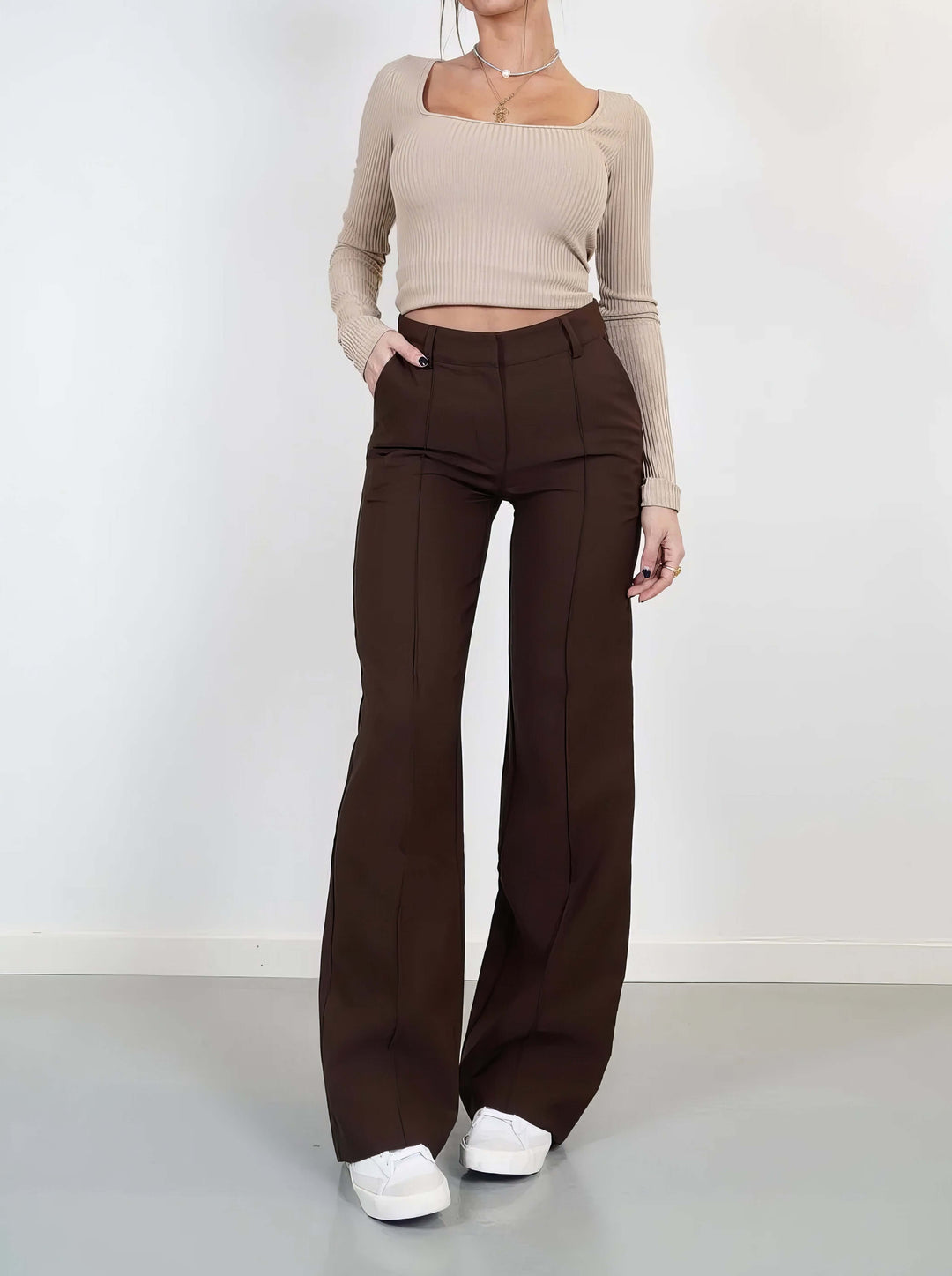 Flowy polyester wide leg trousers for women, designed for ultimate comfort and refined style.