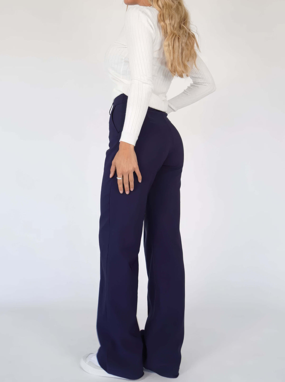 Chic wide leg trousers in white, providing a relaxed and elegant fit for contemporary women.