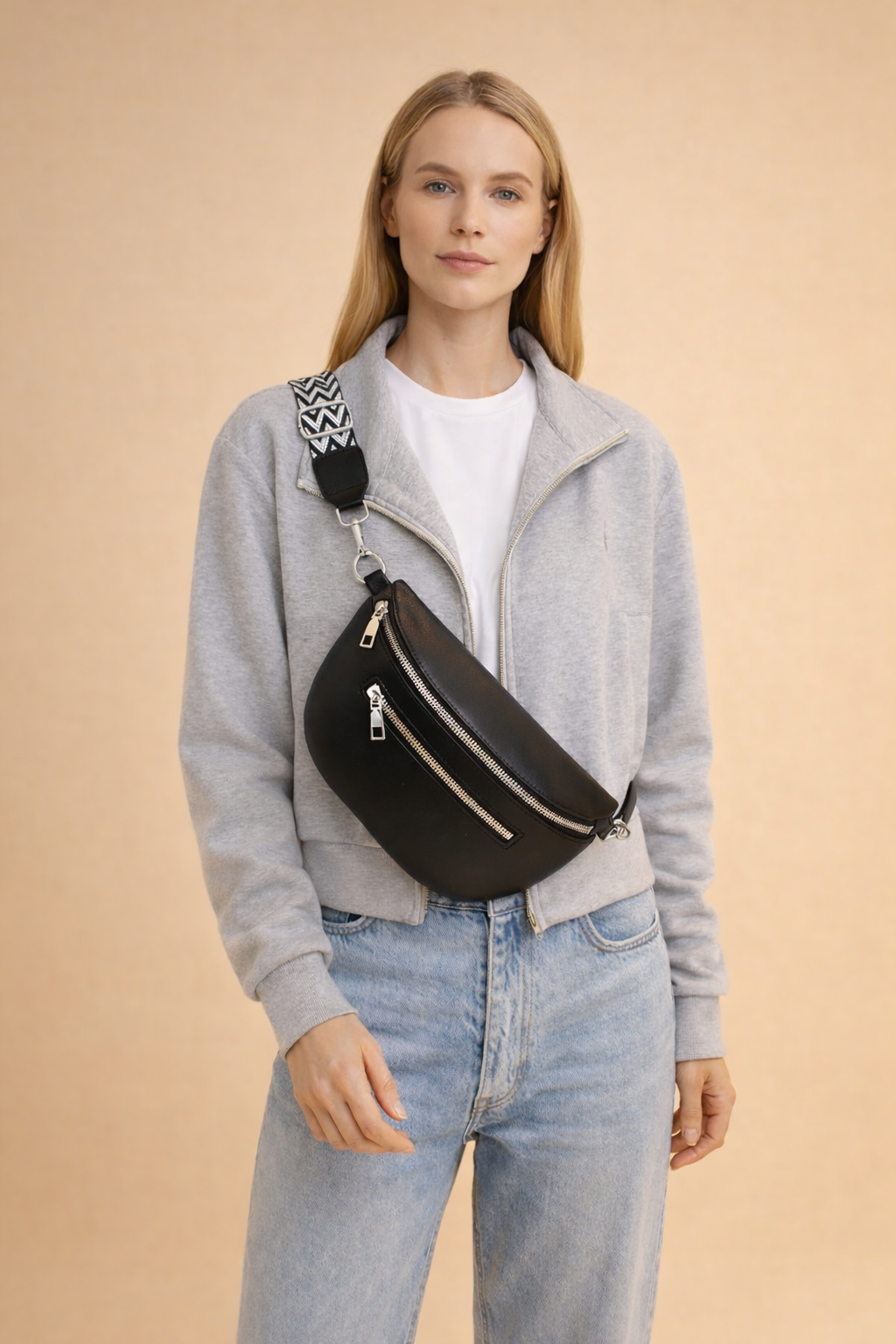 Stylish black women's elegant crossbody/belt bag. Practical and chic everyday fashion accessory with modern styling.