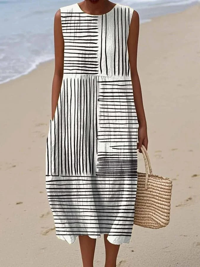 Elegant black women's flowy midi dress, flattering & versatile for summer casual or evening wear.