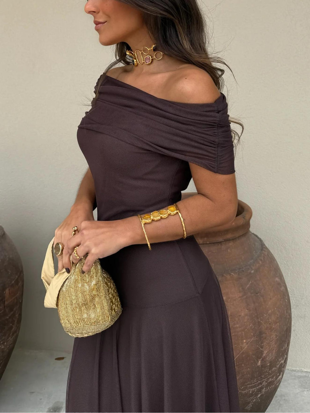 Chic brown off-shoulder maxi dress for women, ideal for special occasions and evening wear.