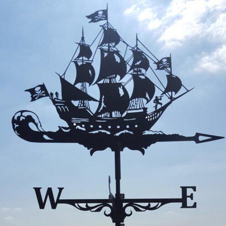 Rustic metal dragon weather vane, an eye-catching wind indicator for outdoor spaces.